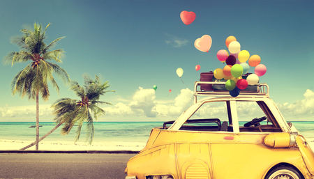 50569433 - vintage yellow car with heart colorful balloon on beach blue sky - concept of love in summer and wedding. honeymoon trip